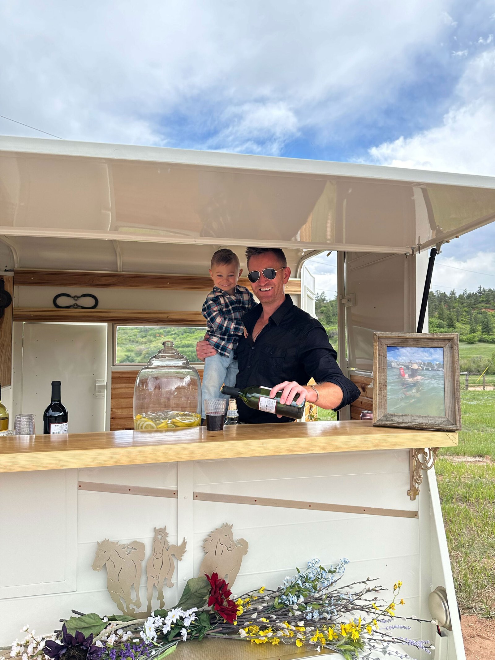 Serving drinks and sharing a family moment at the finished Pony Pub bar.