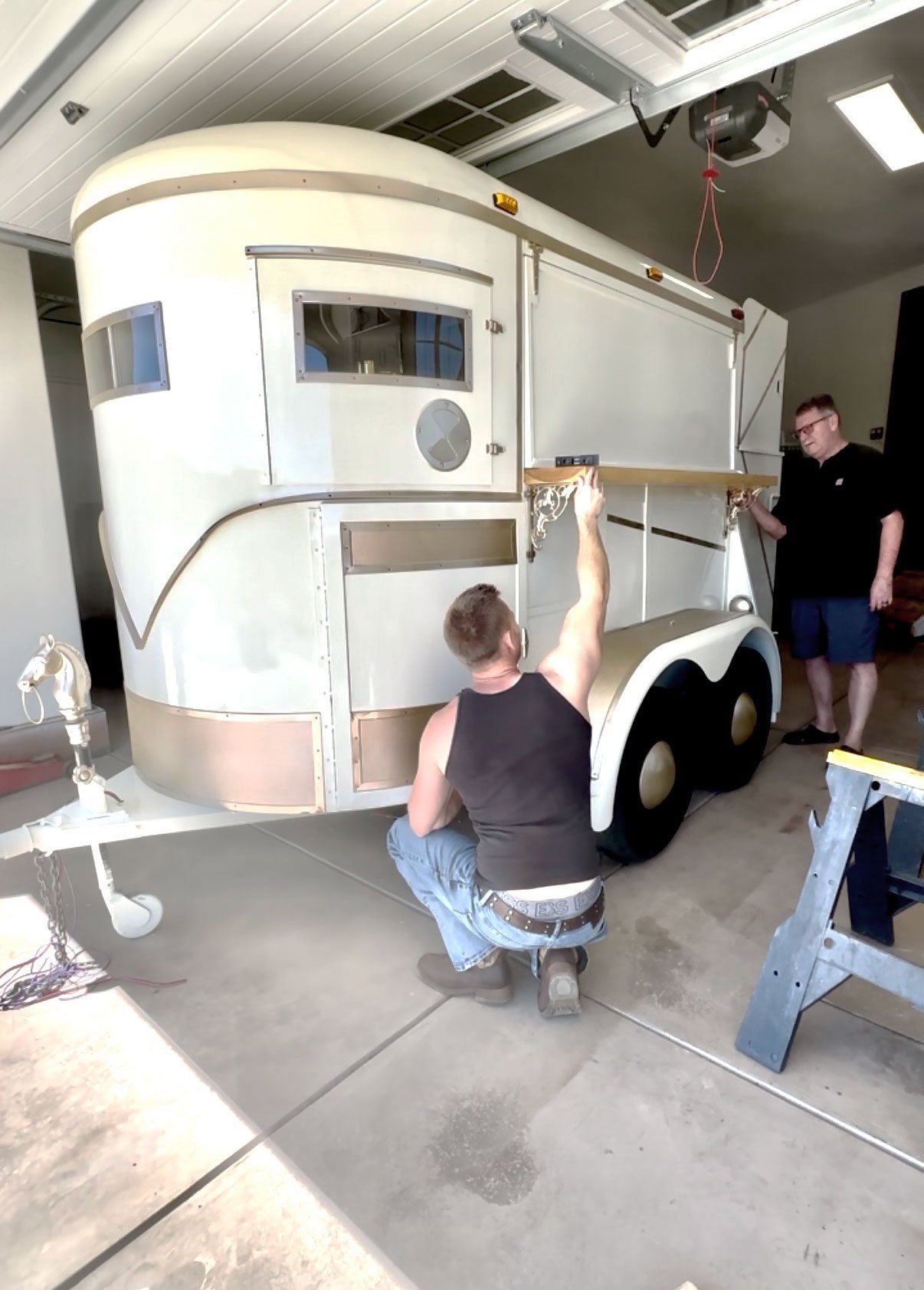 Cody and James Muth fitting the hickory serving station to the trailer.